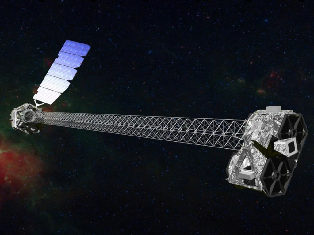 El telescopio espacial NuSTAR de la NASA, visto aquí en un concepto artístico, se utilizó por primera vez para detectar la "región de inmersión" alrededor de un agujero negro. (NASA/JPL-Caltech)