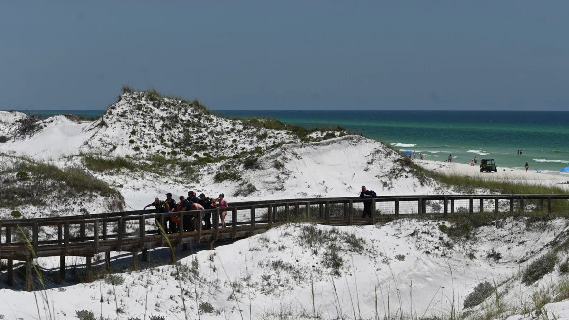 Three people were injured in two shark attacks off neighboring Florida beaches 90 minutes apart